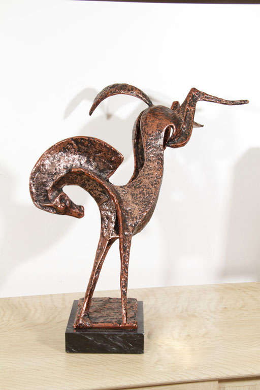 Wonderful, spirited modernist horse sculpture on black marble base. Hammered iron with copper finish. Please contact for location. 